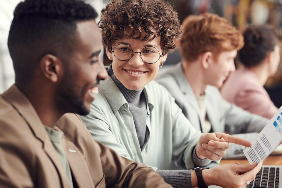 A group of professionals working together on computers, symbolizing certified cybersecurity analysts making a difference in the digital world.