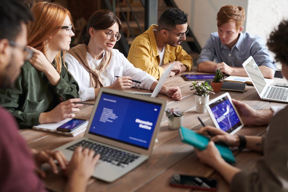 A diverse group of professionals working together to enhance cybersecurity.