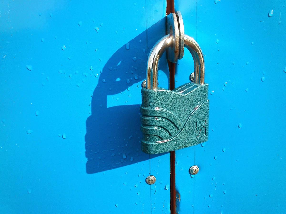 A computer screen showing a lock and a hacker symbol, representing cybersecurity risk assessment